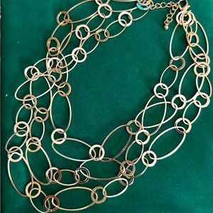 Beautiful fun gold three strand necklace very light weight dress up or down